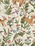 Animal fabric. Leapong deer and flying birds in a meadow of blue and pink flowers, Indian folklore style.