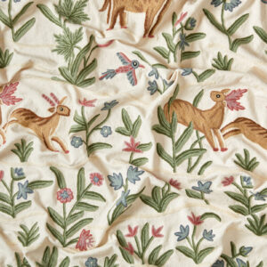 Animal fabric. Leapong deer and flying birds in a meadow of blue and pink flowers, Indian folklore style.