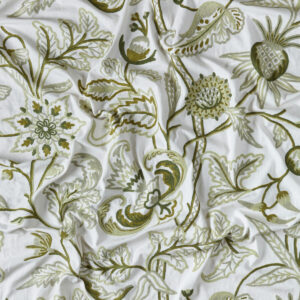 Green and cream fabric, hand embroidered in a floral design.